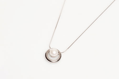 This elegant white pearl pendant will become your new best friend for day to evening wear.